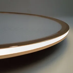 Plafón de techo modelo Titania con diseño circular y aro metálico en color oro rosa, ideal para interiores elegantes.