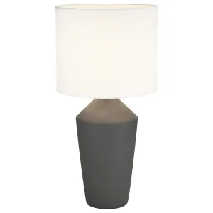 Lámpara de sobremesa con base de cerámica en cuatro colores y pantalla de tela blanca. Aporta una luz cálida y acogedora ideal para salones y dormitorios, con un diseño elegante y sofisticado.